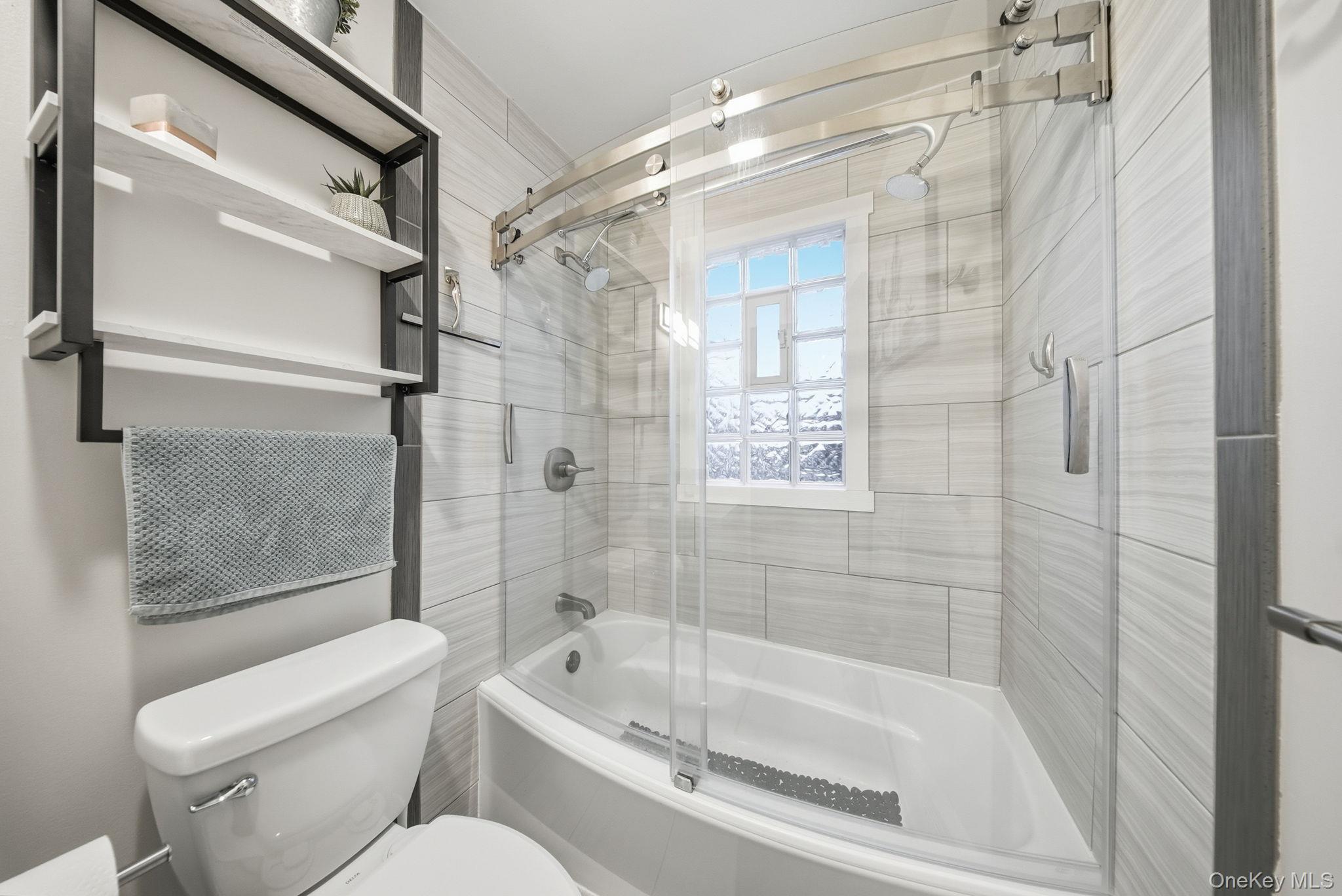 41 Low Road Wallkill, NY 12589 - Photo 26 of 37 Bathroom with combined bath / shower with glass door and toilet