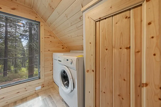 a view of a hallway with washer and dryer