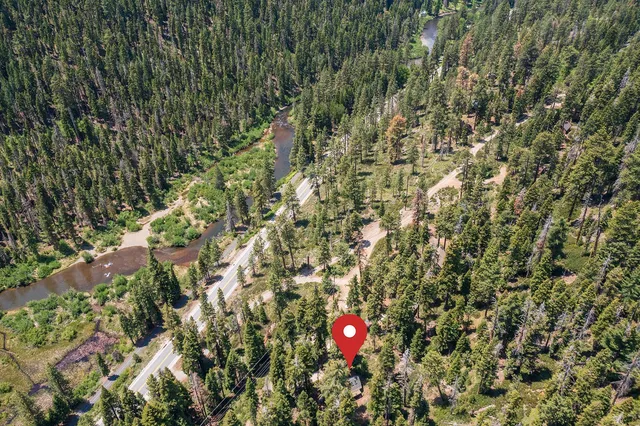 a view of a house with backyard and deck