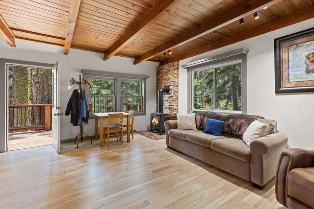 a living room with furniture and large windows