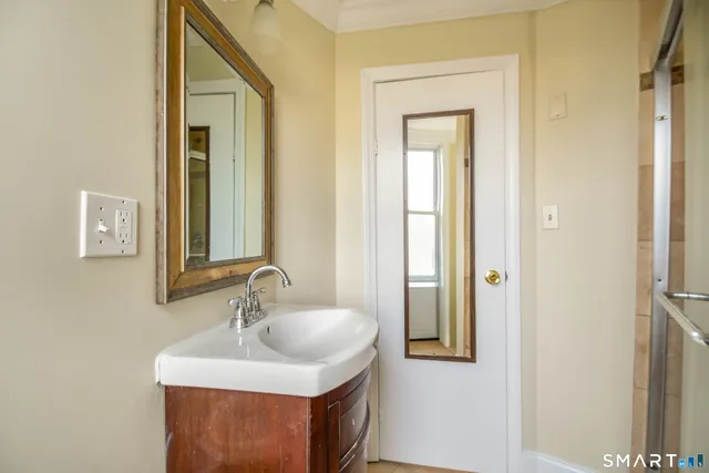 a bathroom with a sink and a mirror