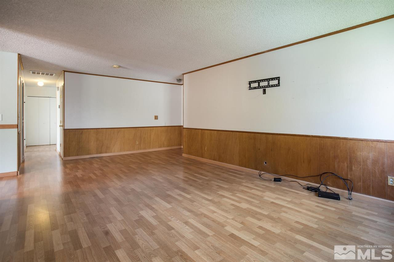 2980 Cisco Way Reno, NV 89502 - Photo 6 of 20 an empty room with wooden floor and windows