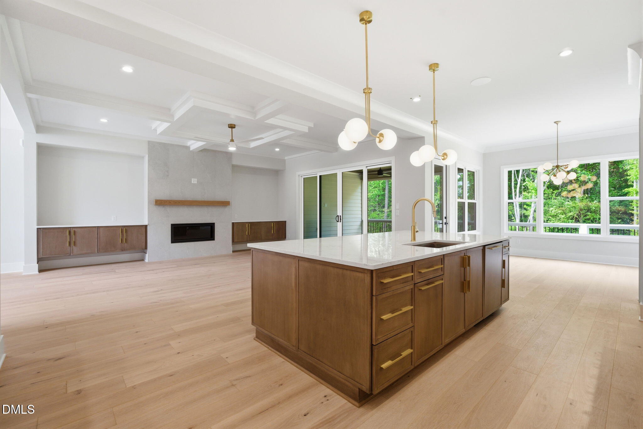 1304 Sanctuary Pond Drive Raleigh, NC 27606 - Photo 13 of 52 a large kitchen with kitchen island a large counter top a stove and a wooden floors