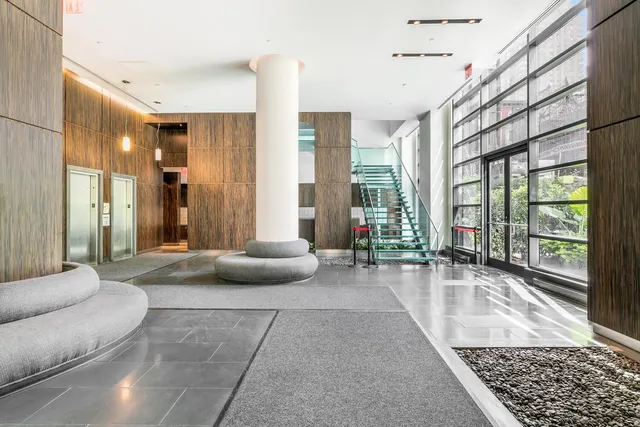 a view of a chair and table in the patio of the house