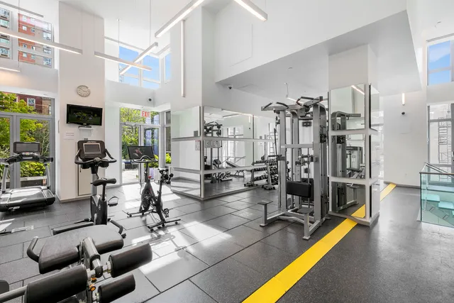 a bathroom with a toilet a sink and a mirror