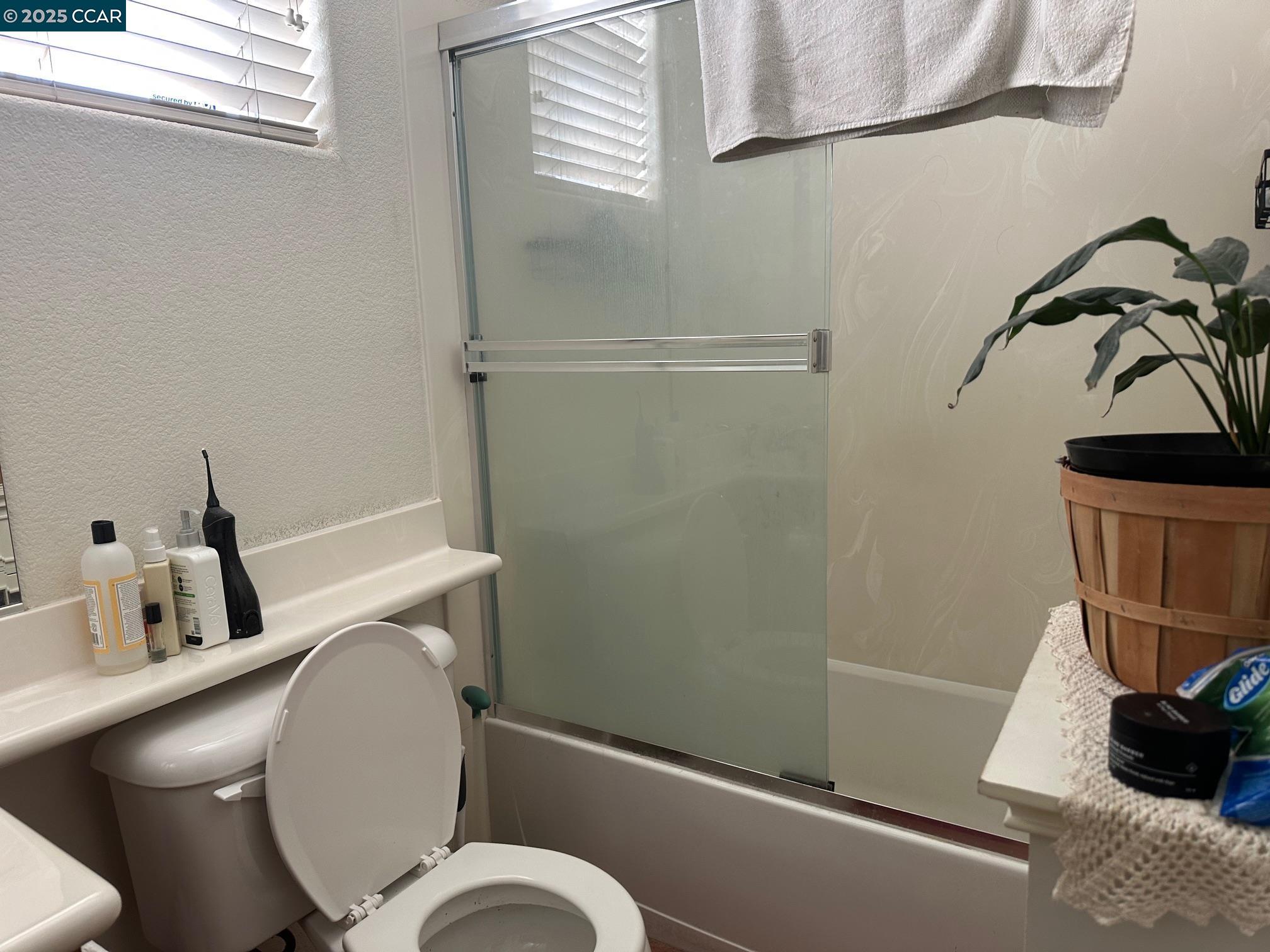 584 Silver Maple Drive Hercules, CA 94547 - Photo 11 of 19 a bathroom with a toilet and a sink
