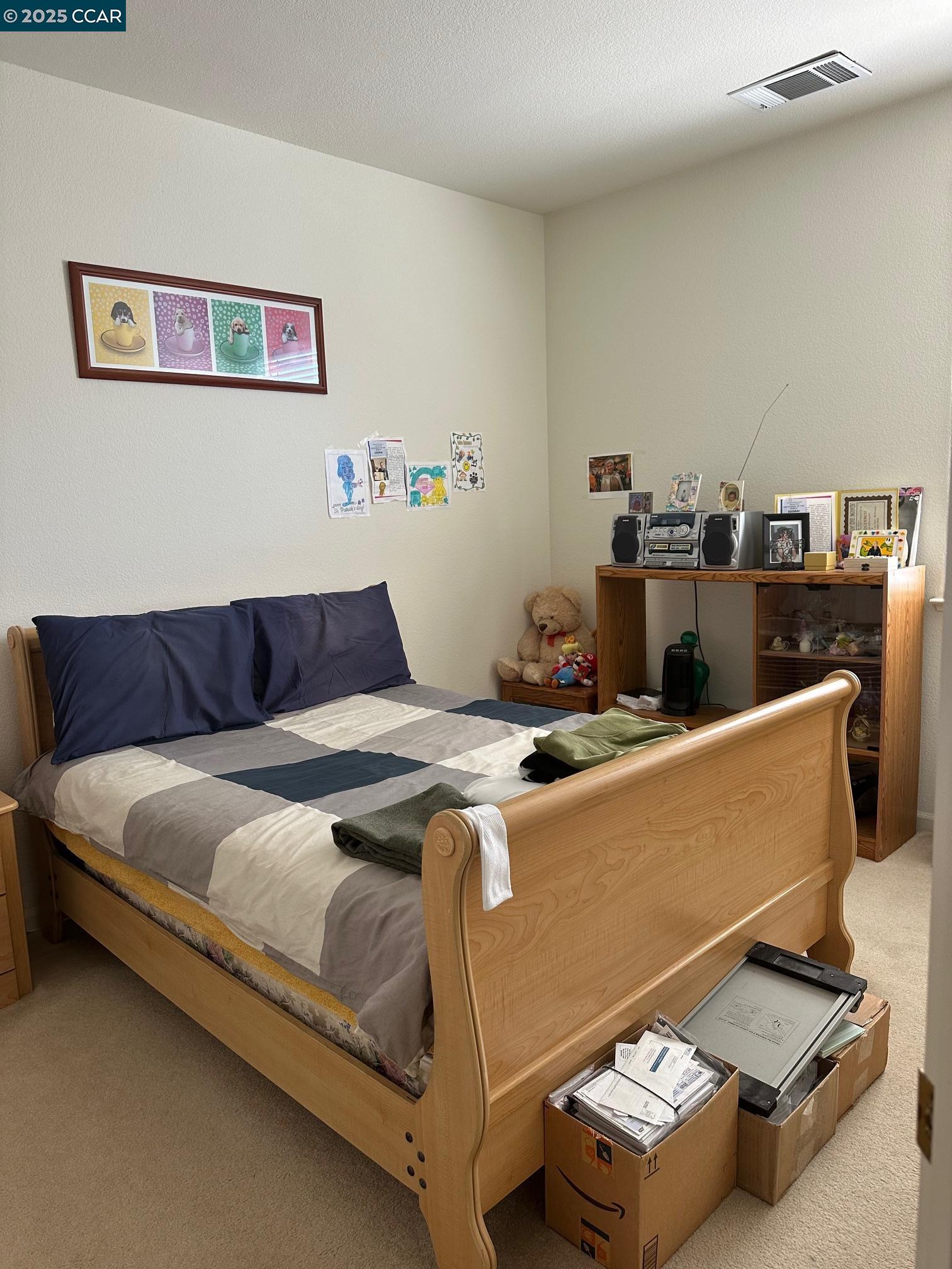 584 Silver Maple Drive Hercules, CA 94547 - Photo 12 of 19 a bed sitting in a bedroom next to a window