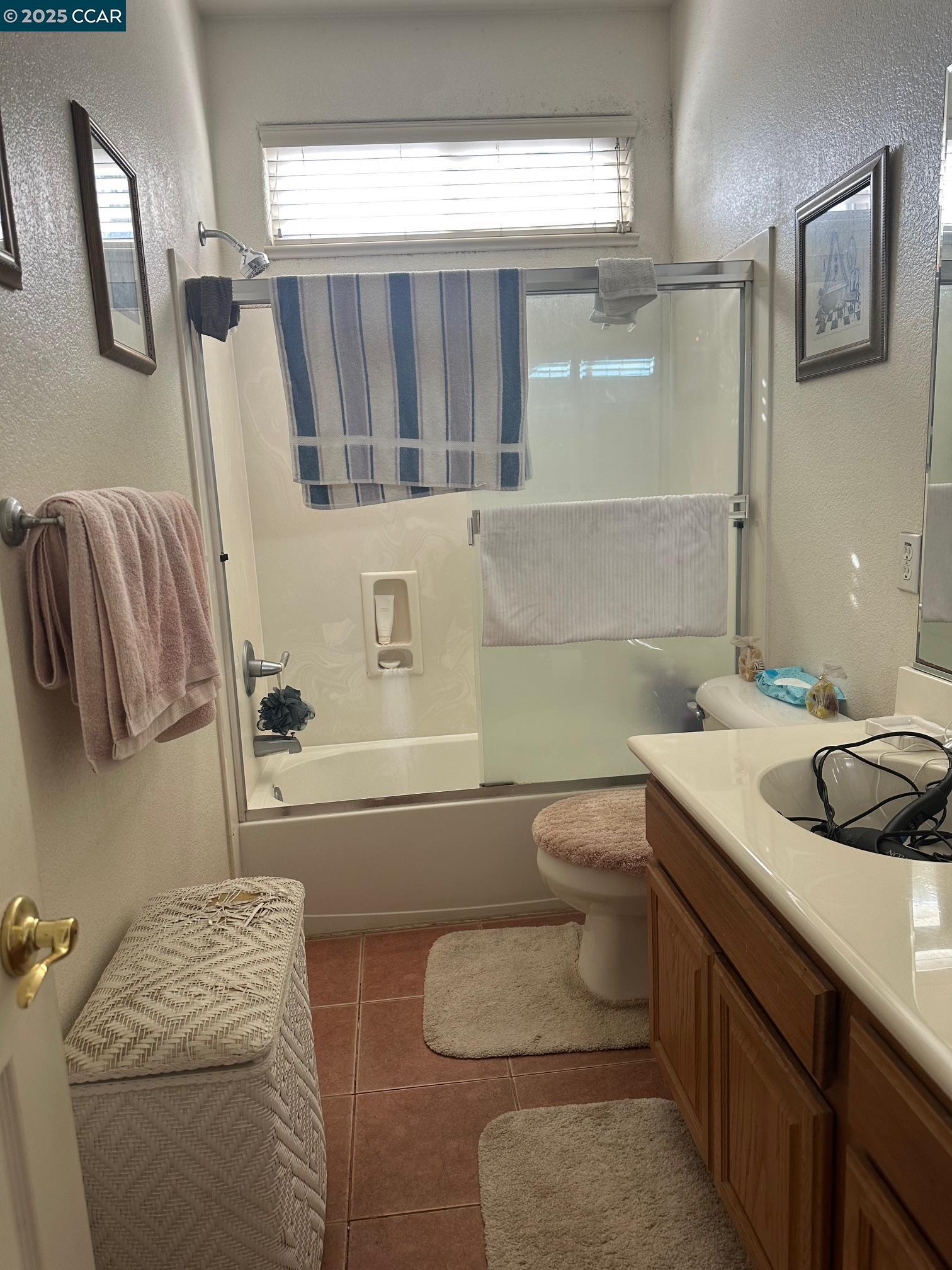 584 Silver Maple Drive Hercules, CA 94547 - Photo 14 of 19 a bathroom with a granite countertop sink and a mirror