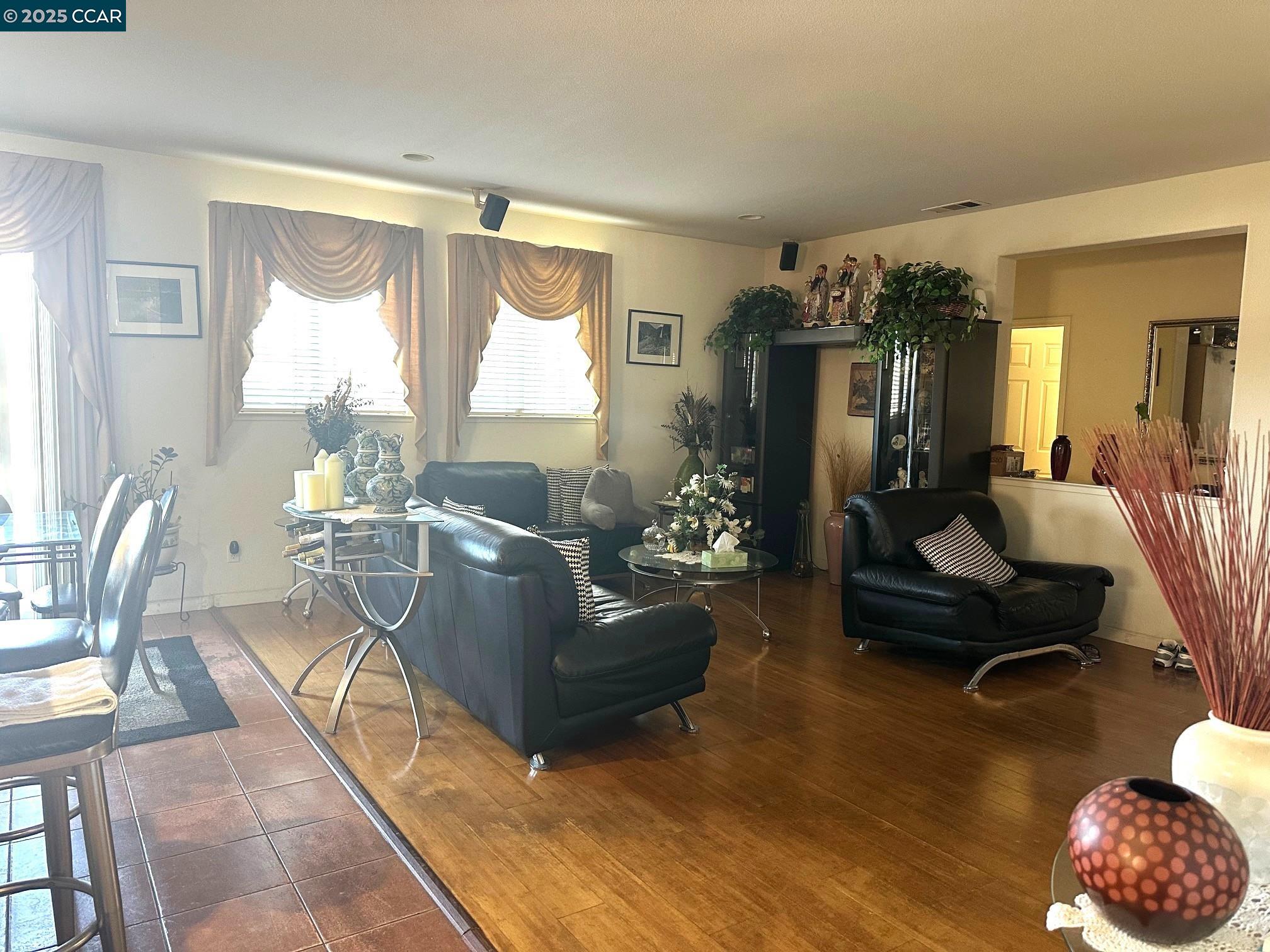 584 Silver Maple Drive Hercules, CA 94547 - Photo 7 of 19 a living room with furniture and a large window