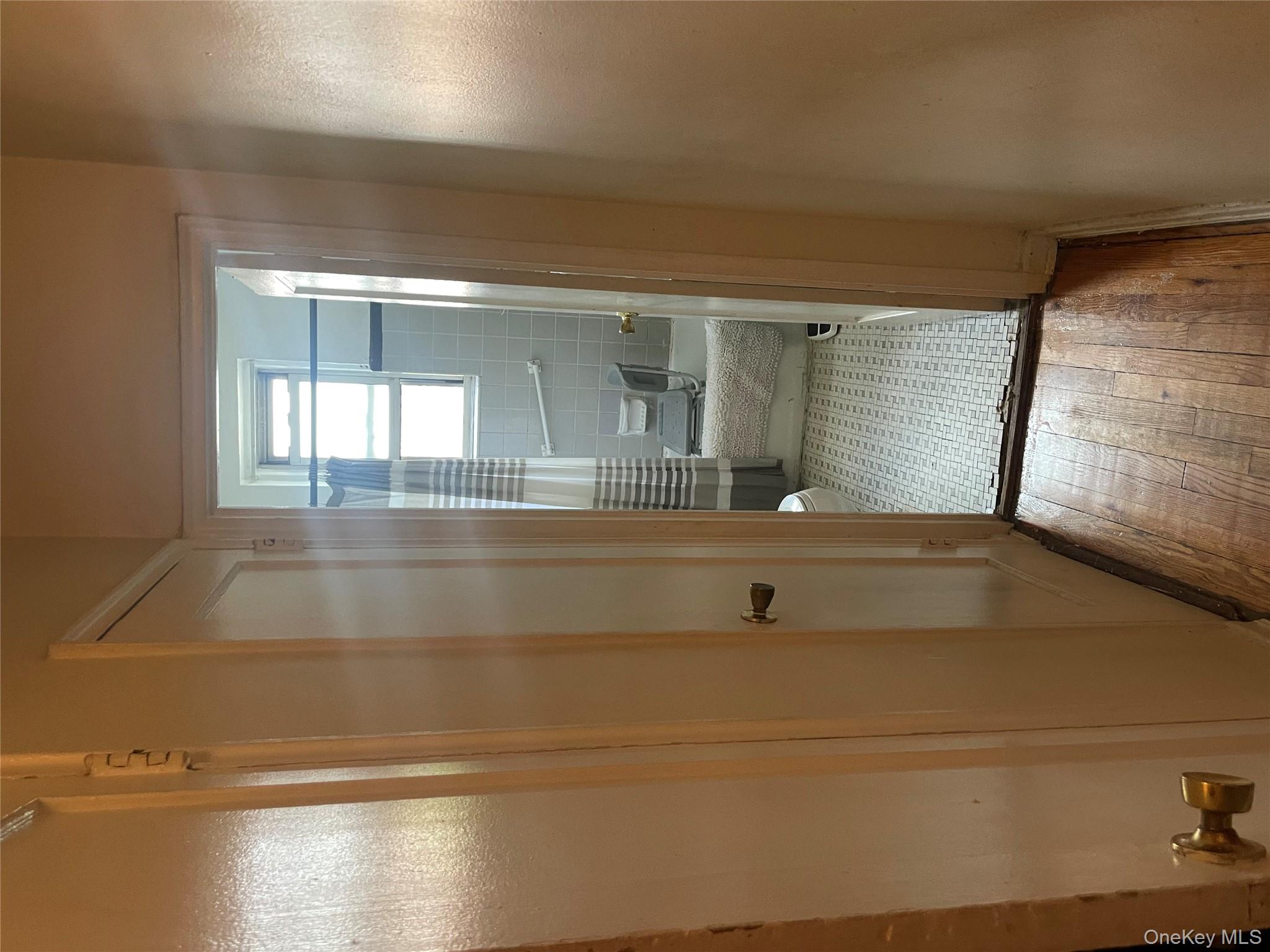 5614 Netherland Avenue, Unit 4A Bronx, NY 10471 - Photo 12 of 19 a bathroom with a wooden floor and a shower