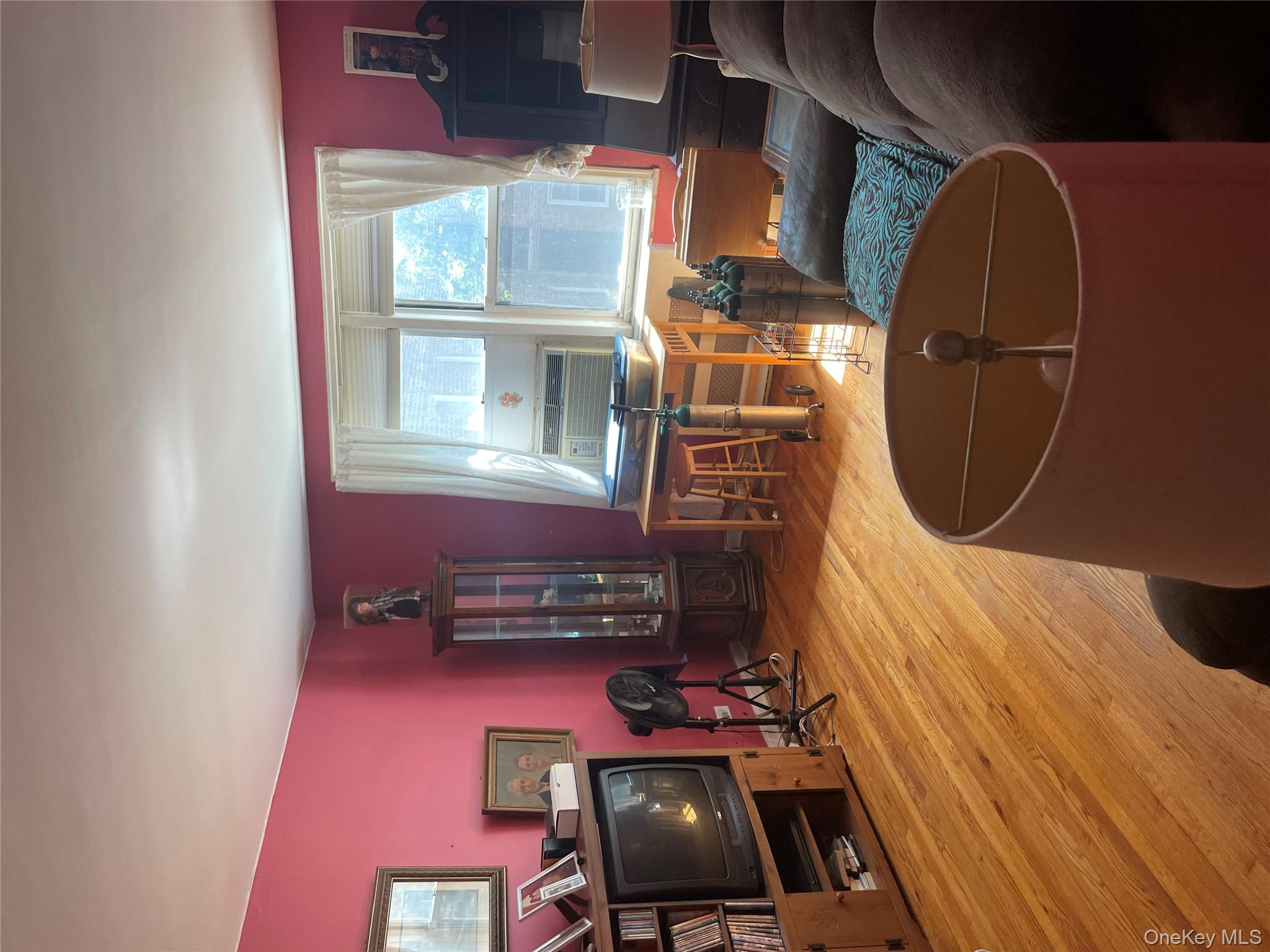 5614 Netherland Avenue, Unit 4A Bronx, NY 10471 - Photo 13 of 19 a room with furniture and a flat screen tv