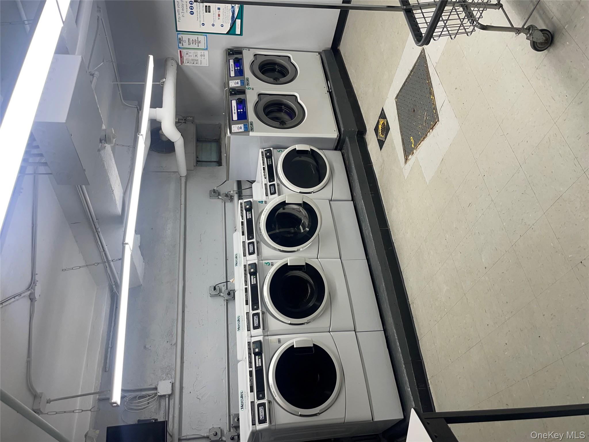 5614 Netherland Avenue, Unit 4A Bronx, NY 10471 - Photo 14 of 19 a utility room with dryer and washer