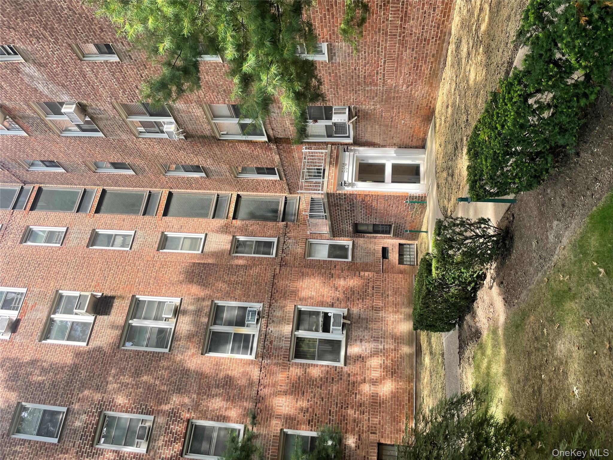 5614 Netherland Avenue, Unit 4A Bronx, NY 10471 - Photo 16 of 19 a large building with a outdoor space