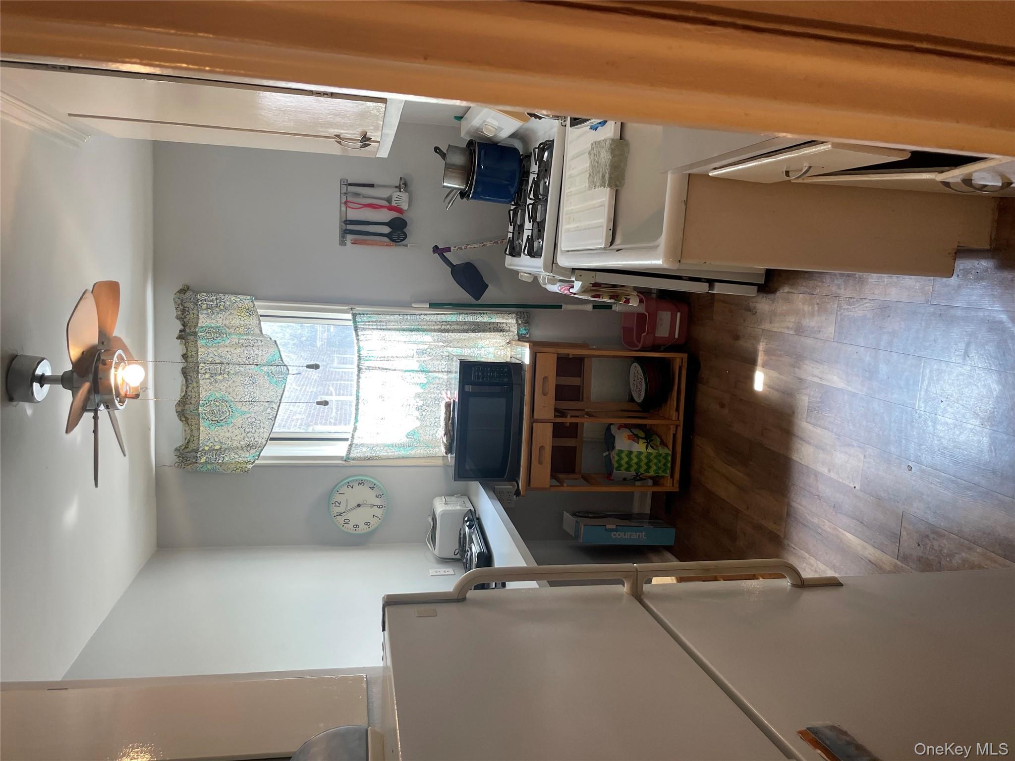 5614 Netherland Avenue, Unit 4A Bronx, NY 10471 - Photo 3 of 19 a living room with furniture and a fireplace