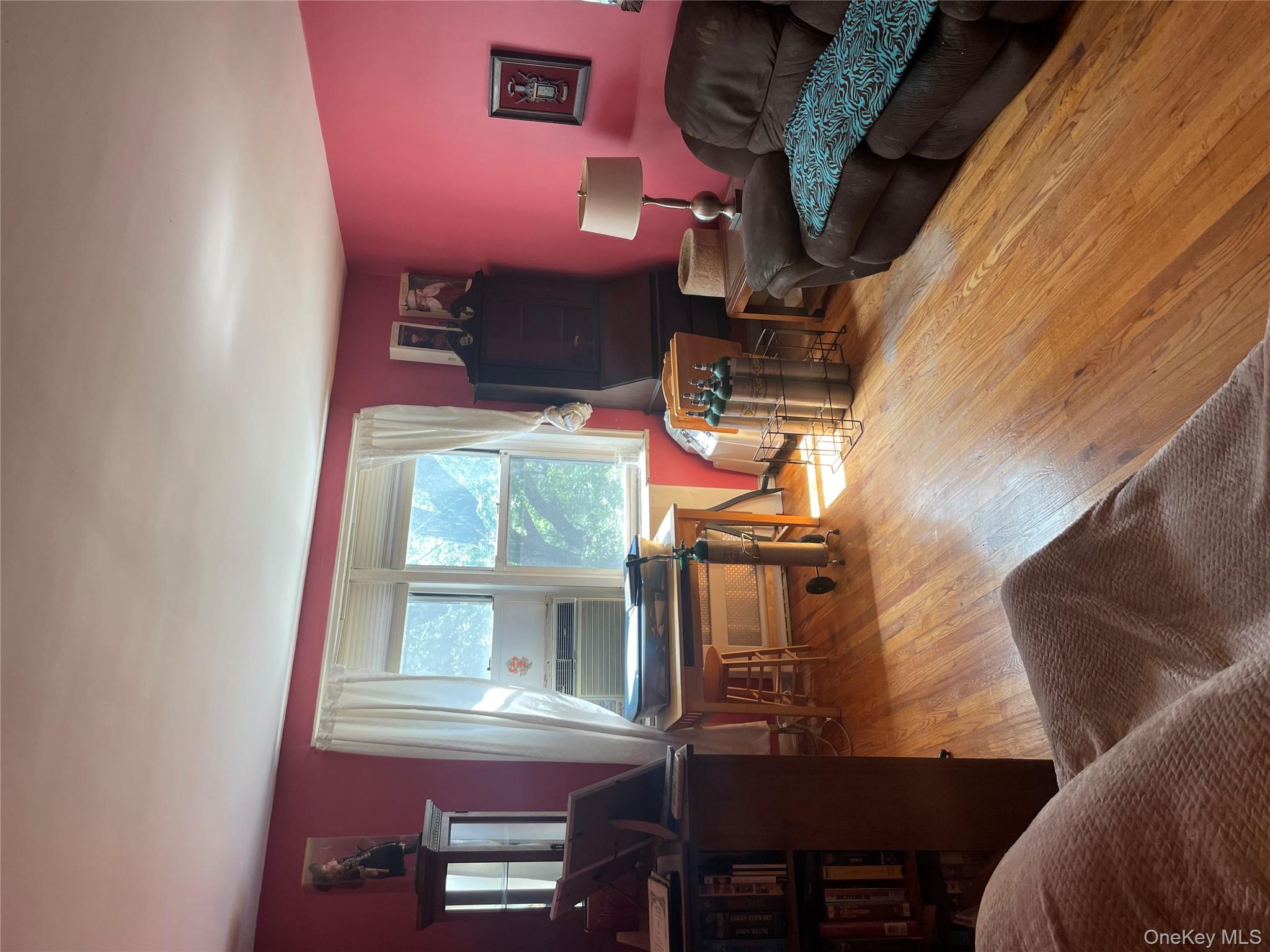 5614 Netherland Avenue, Unit 4A Bronx, NY 10471 - Photo 6 of 19 a living room with furniture and a large window
