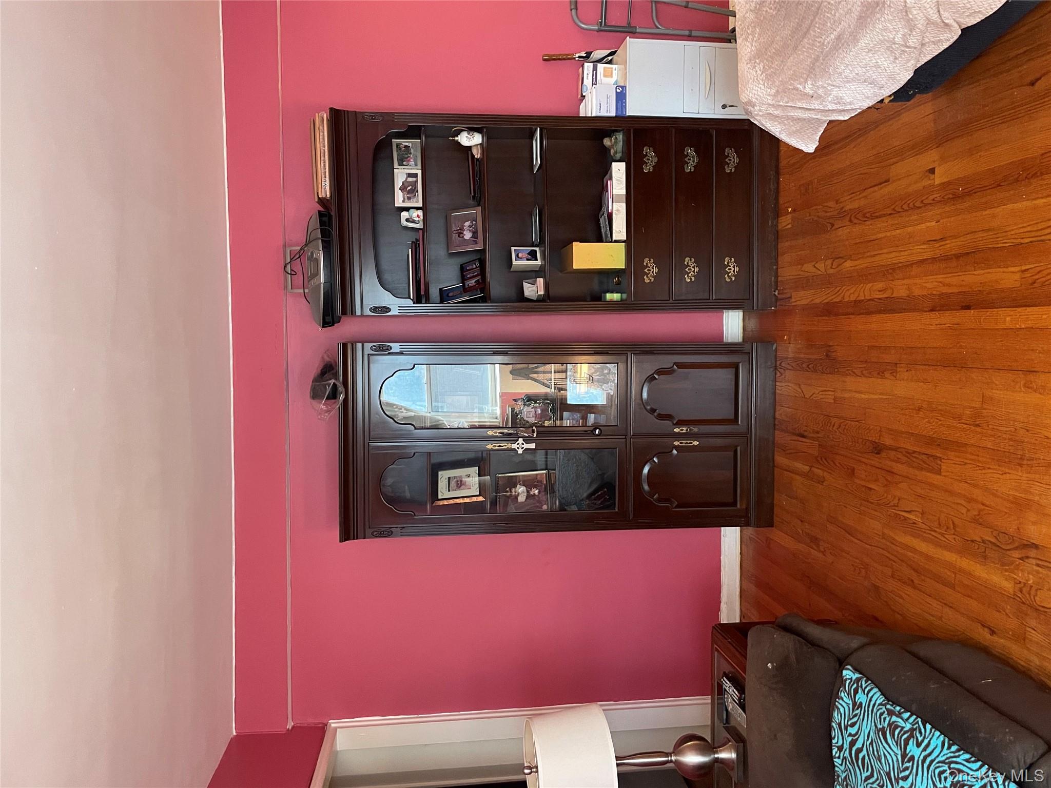 5614 Netherland Avenue, Unit 4A Bronx, NY 10471 - Photo 7 of 19 a living room with a bed and furniture