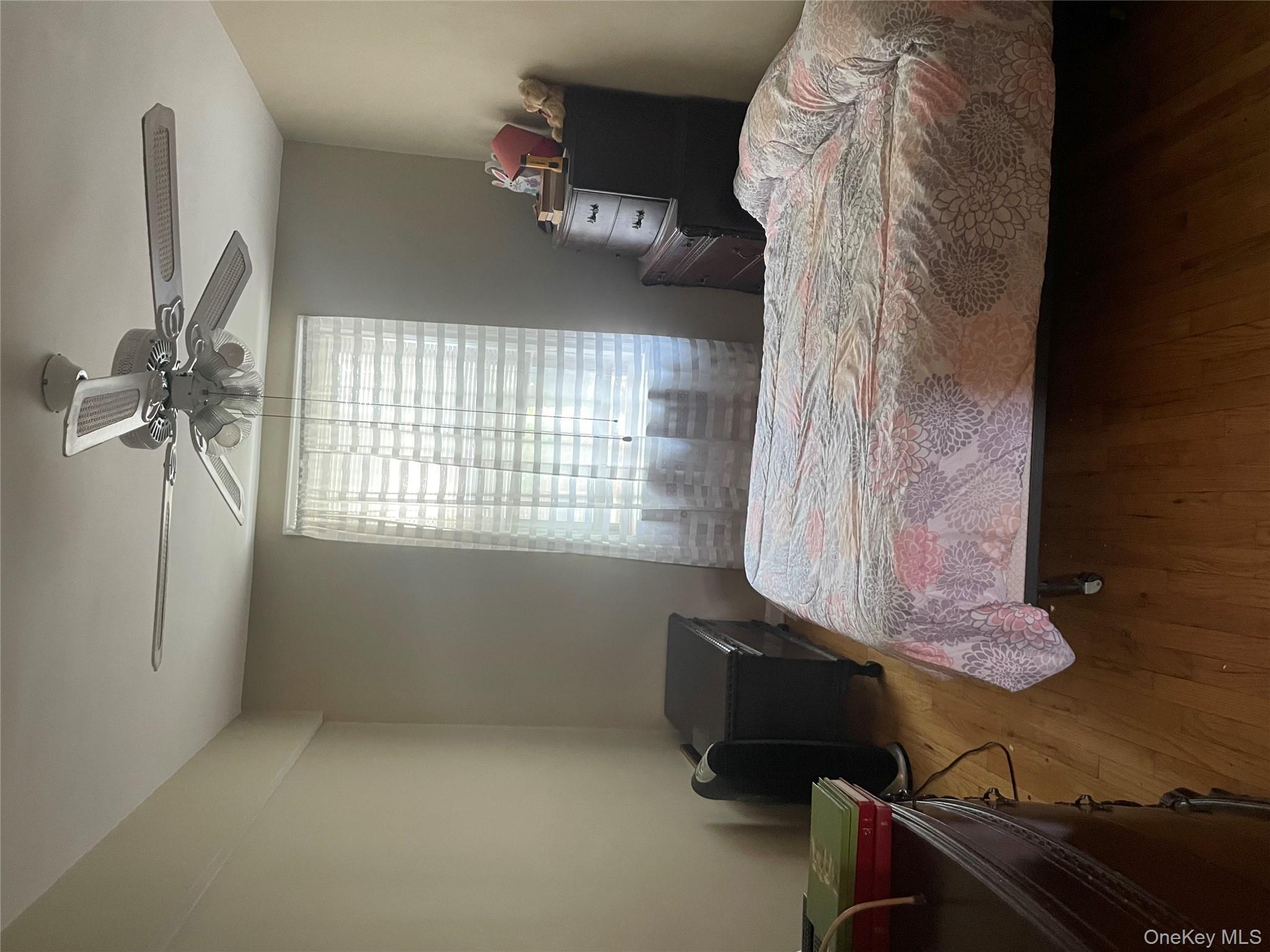 5614 Netherland Avenue, Unit 4A Bronx, NY 10471 - Photo 8 of 19 a bedroom with a bed and window