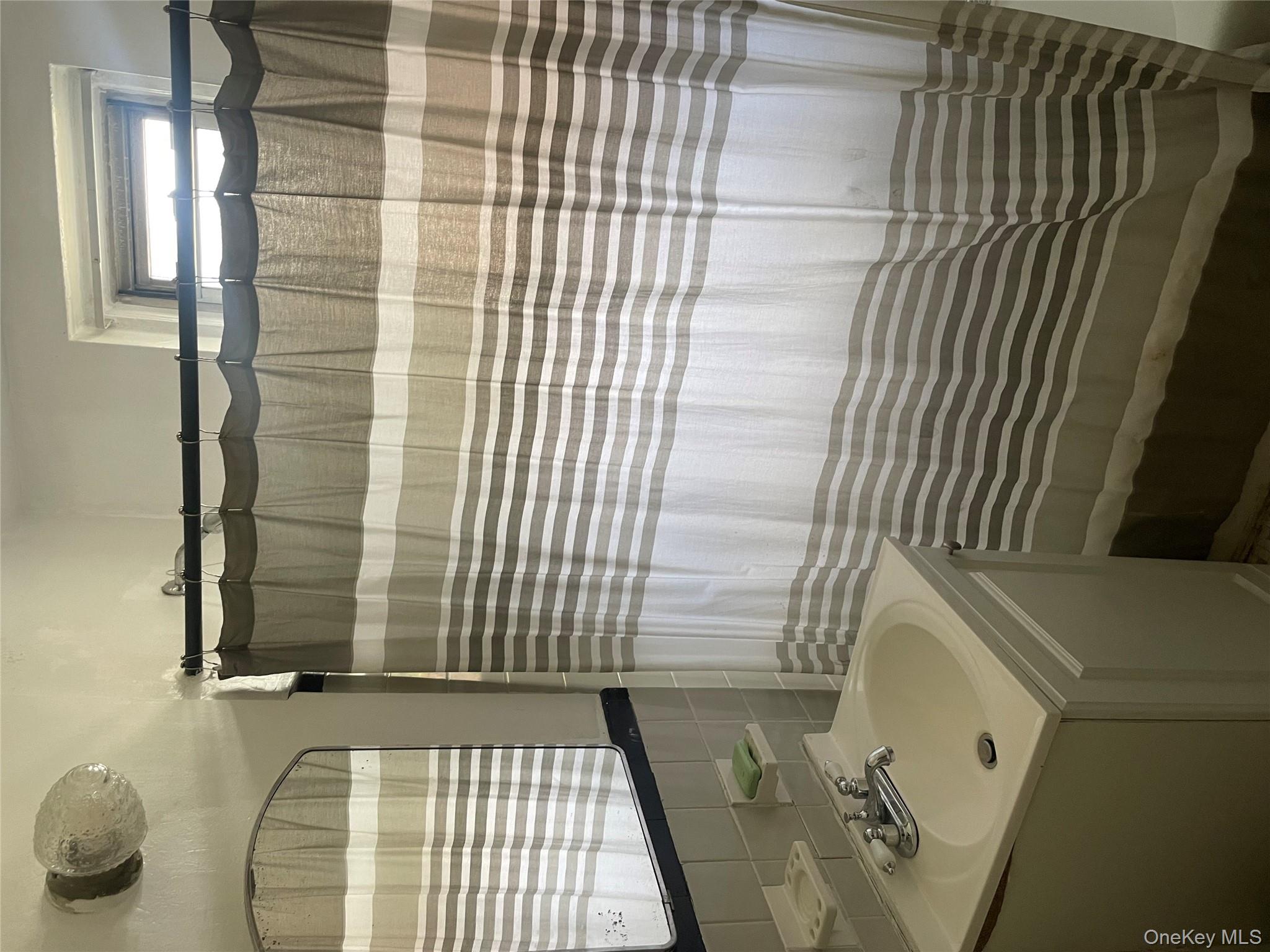 5614 Netherland Avenue, Unit 4A Bronx, NY 10471 - Photo 9 of 19 a bathroom with a sink a toilet and shower