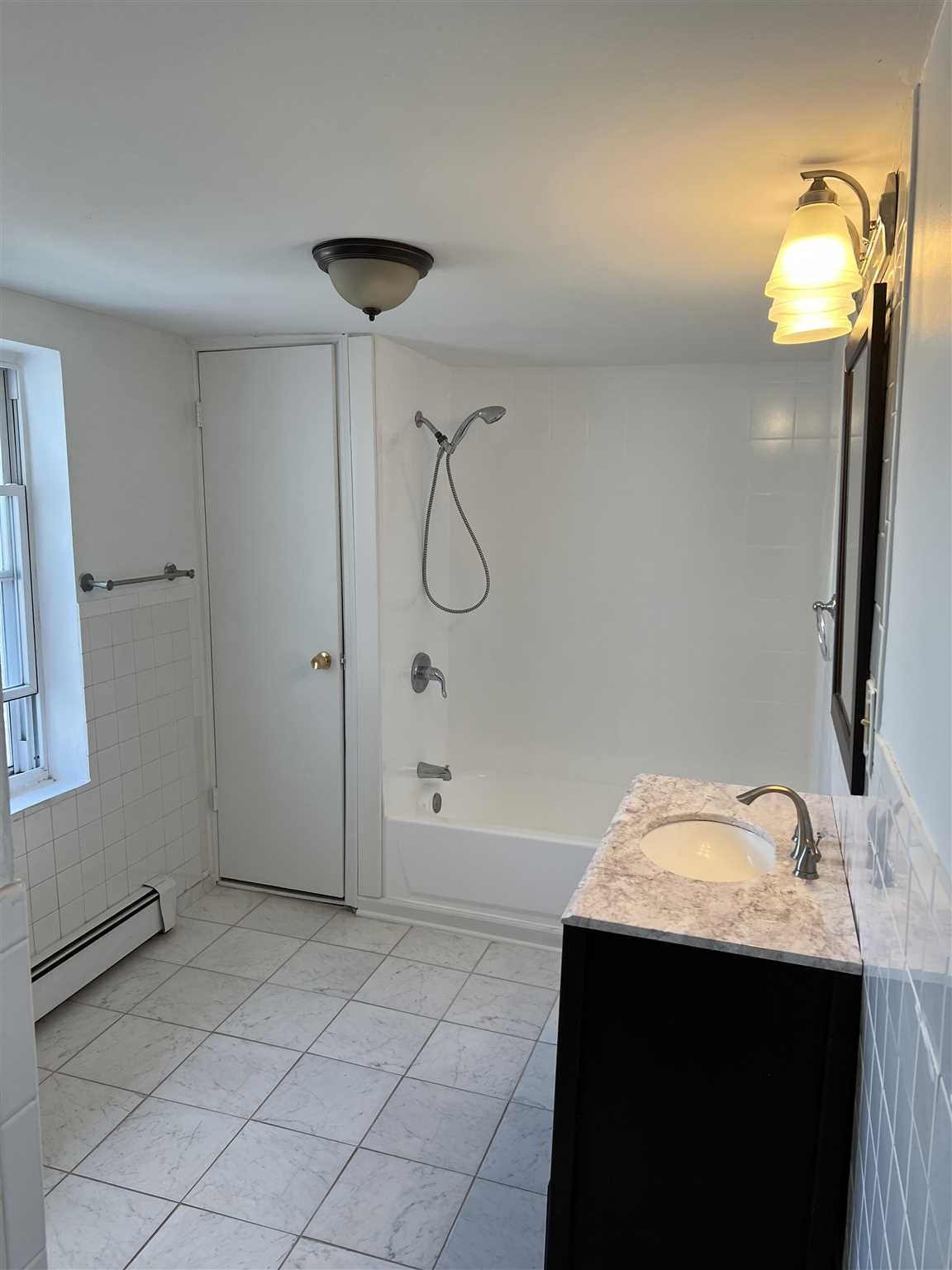 1 Dewindt Street Beacon, NY 12508 - Photo 6 of 12 a bathroom with a sink and a mirror