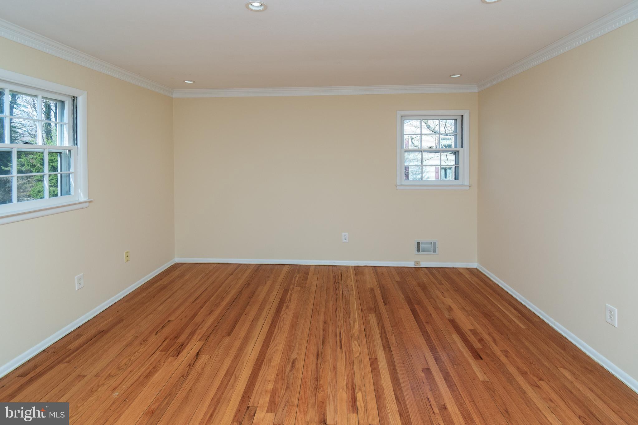 6 Jeffrey Lane Princeton Junction, NJ 08550 - Photo 33 of 66 an empty room with wooden floor and windows