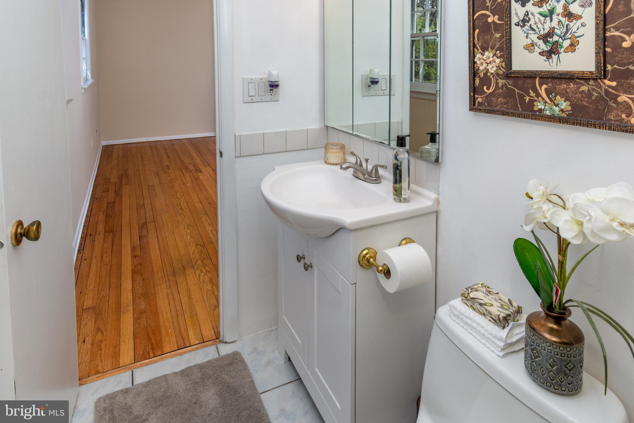 6 Jeffrey Lane Princeton Junction, NJ 08550 - Photo 36 of 66 a bathroom with a sink a mirror and vanity
