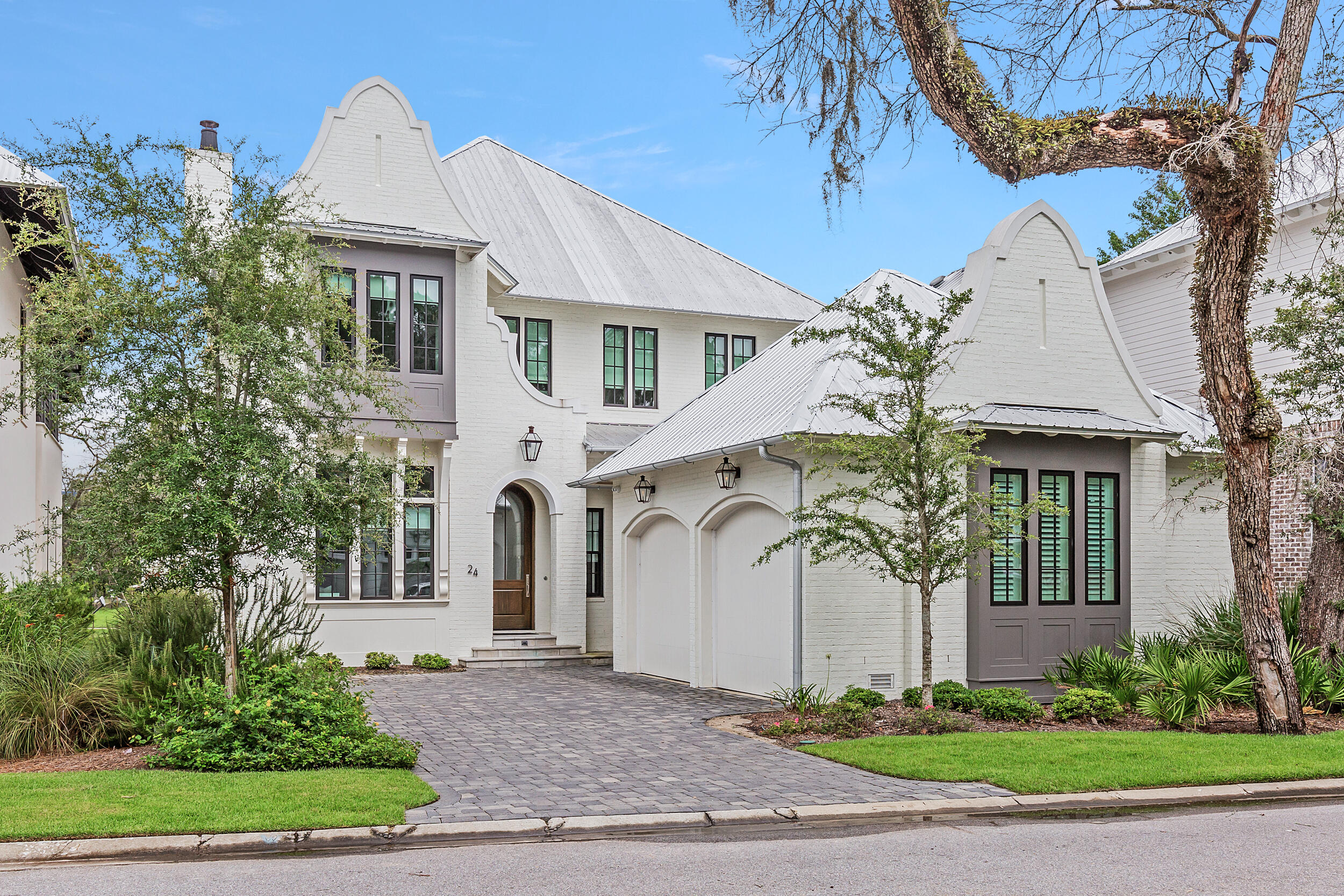 24 Bennett Santa Rosa Beach, FL 32459 - Photo 2 of 74 a front view of a house with a garden