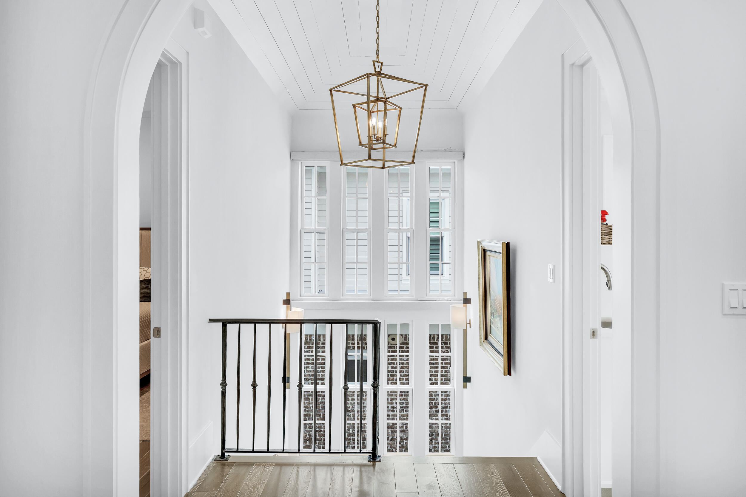 24 Bennett Santa Rosa Beach, FL 32459 - Photo 41 of 74 a view of a hallway with wooden floor and entryway