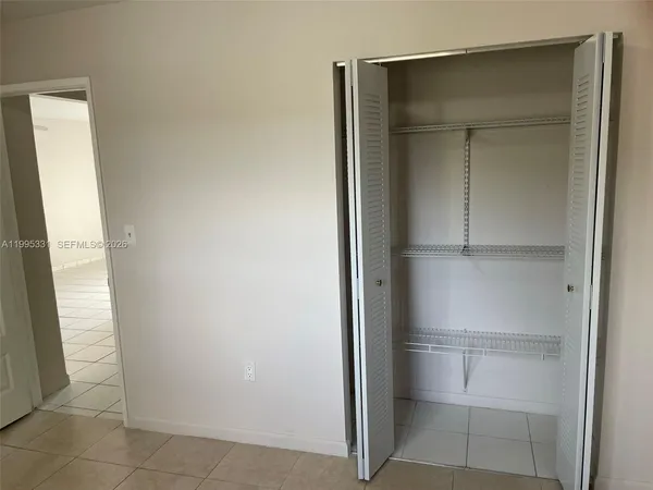 a view of a porch with wooden floor