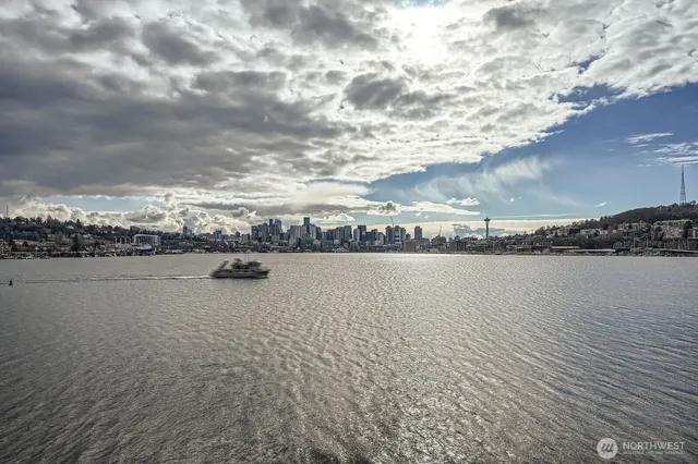 a roof deck with table and chairs