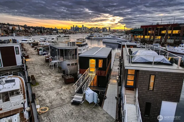 an aerial view of a house with a lake view