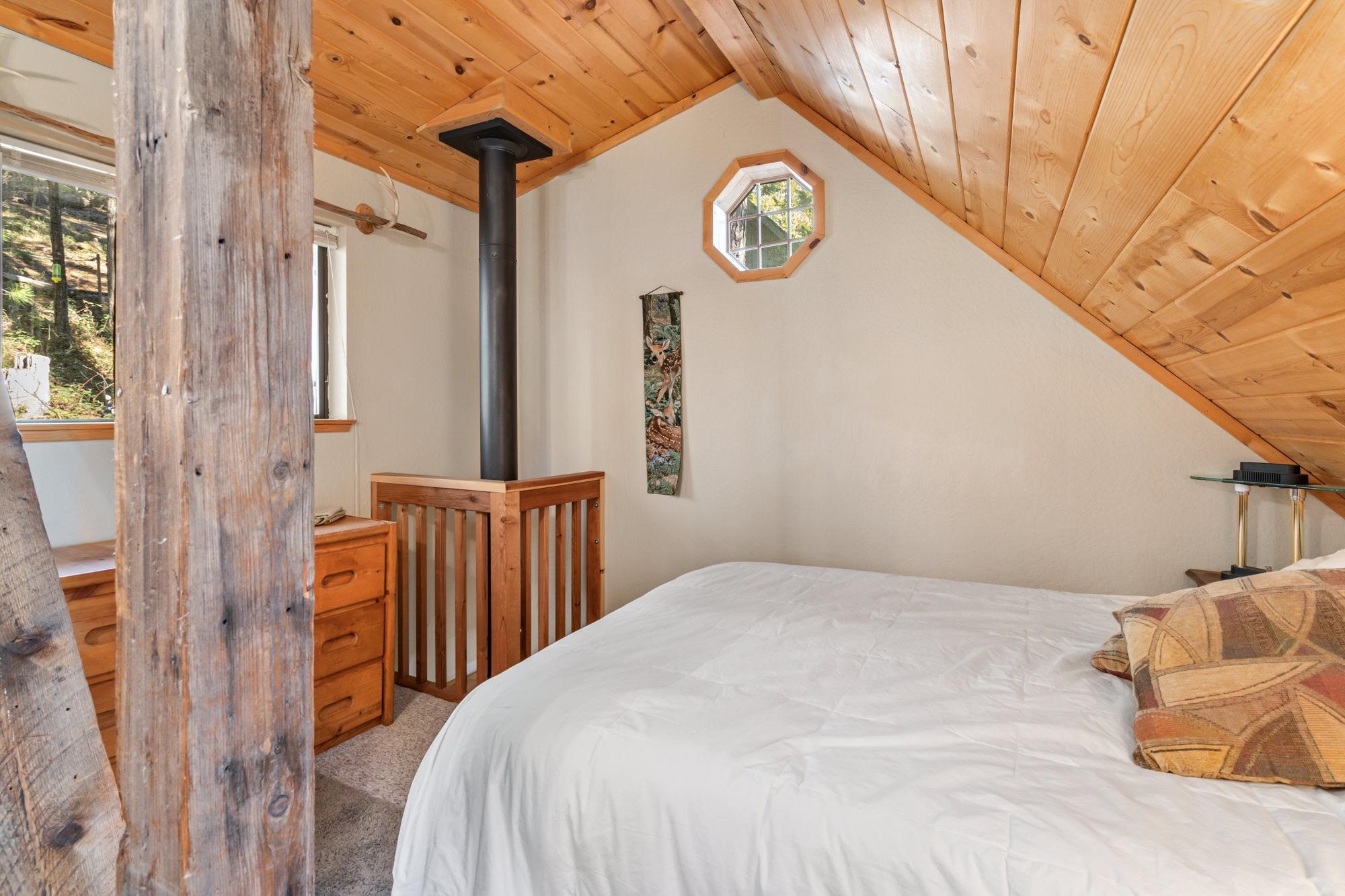 25482 Rebekah Road Long Barn, CA 95335 - Photo 14 of 42 a bedroom with a bed and a window