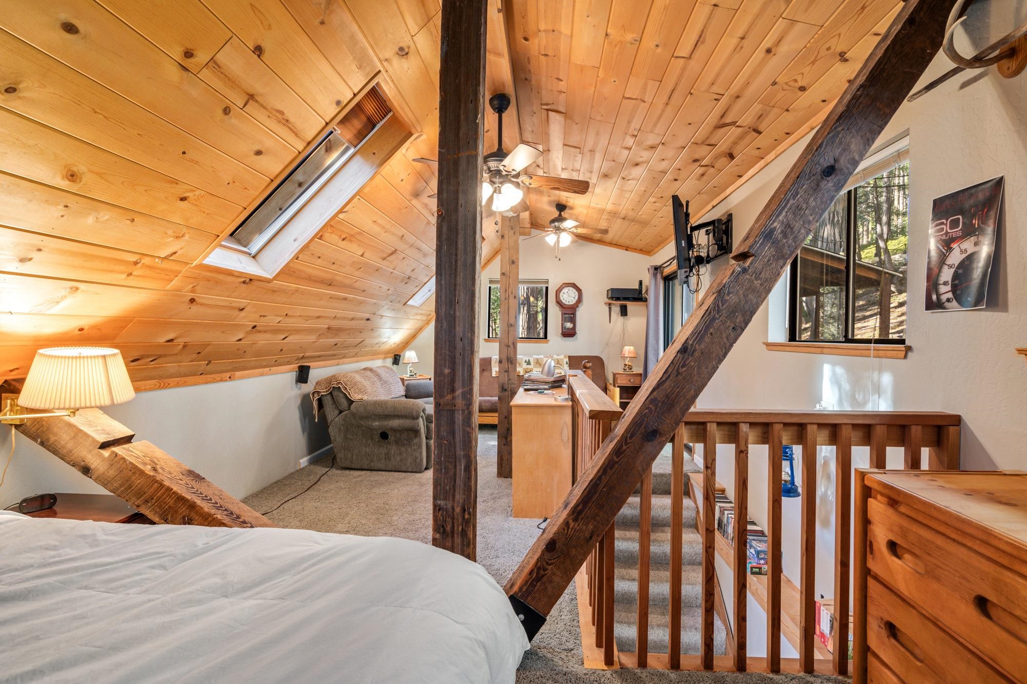 25482 Rebekah Road Long Barn, CA 95335 - Photo 16 of 42 a bedroom with wooden floor and stairs