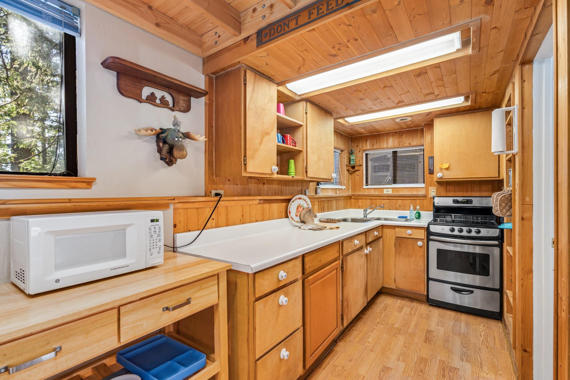 25482 Rebekah Road Long Barn, CA 95335 - Photo 4 of 42 a kitchen with stainless steel appliances granite countertop a stove and a sink