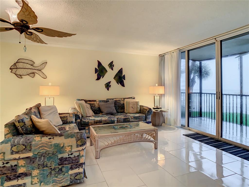 18304 Gulf Boulevard, Unit 116 Redington Shores, FL 33708 - Photo 23 of 51 a living room with furniture