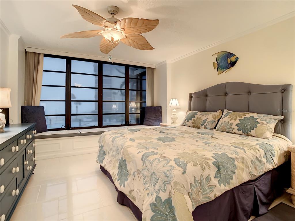 18304 Gulf Boulevard, Unit 116 Redington Shores, FL 33708 - Photo 29 of 51 a bedroom with a bed and a cabinets