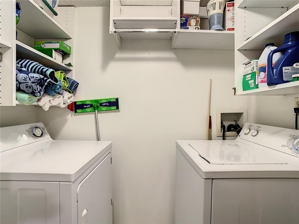 18304 Gulf Boulevard, Unit 116 Redington Shores, FL 33708 - Photo 37 of 51 a utility room with dryer and washer