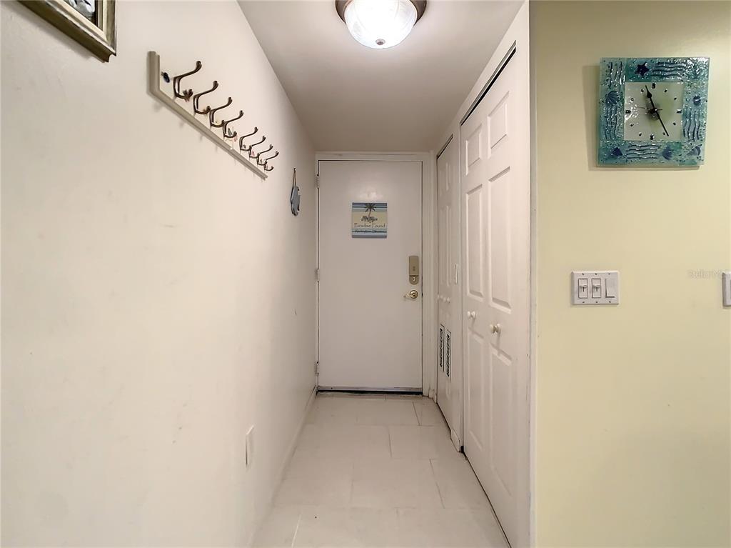 18304 Gulf Boulevard, Unit 116 Redington Shores, FL 33708 - Photo 8 of 51 a view of a hallway with a window