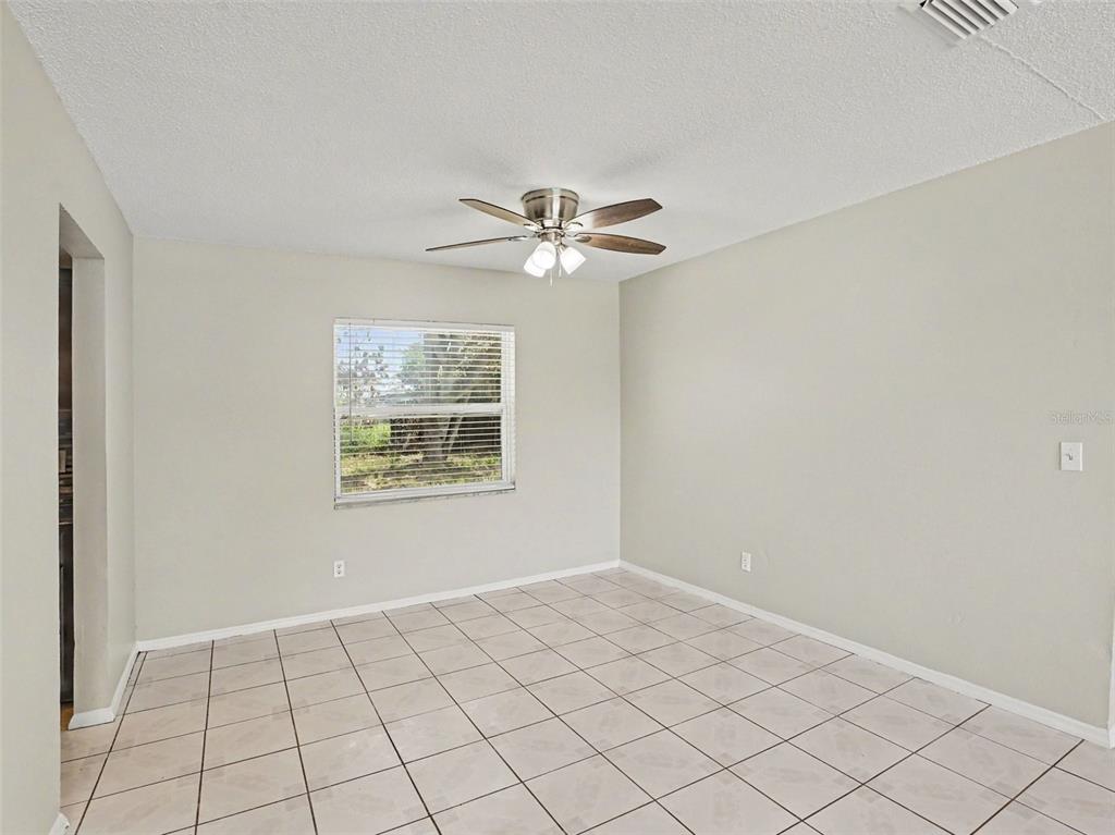 615 Thomas Jefferson Way Orlando, FL 32809 - Photo 8 of 17 a view of an empty room with a window