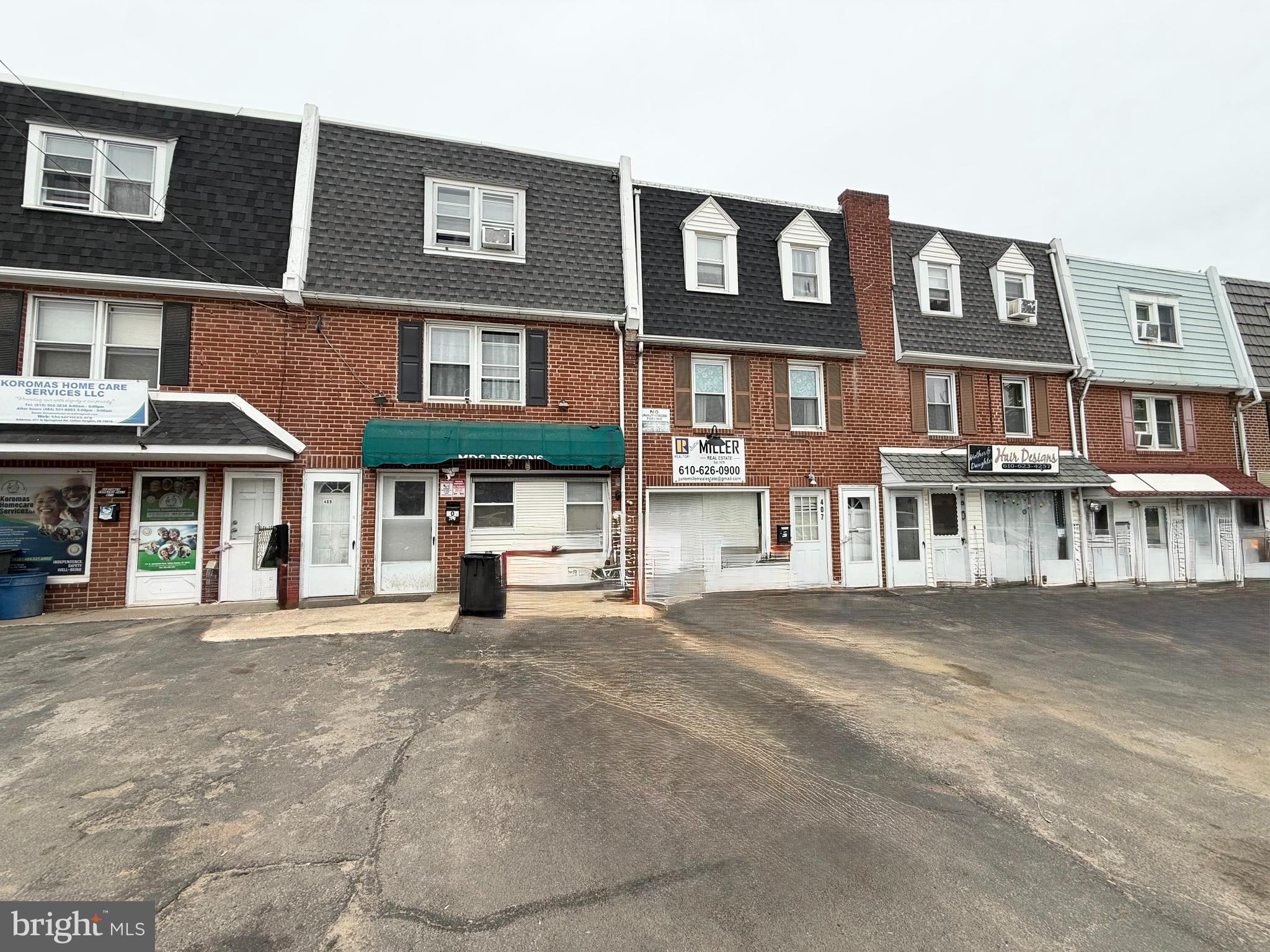 409 North Springfield Road Clifton Heights, PA 19018 - Photo 2 of 10 a front view of a brick building with many windows