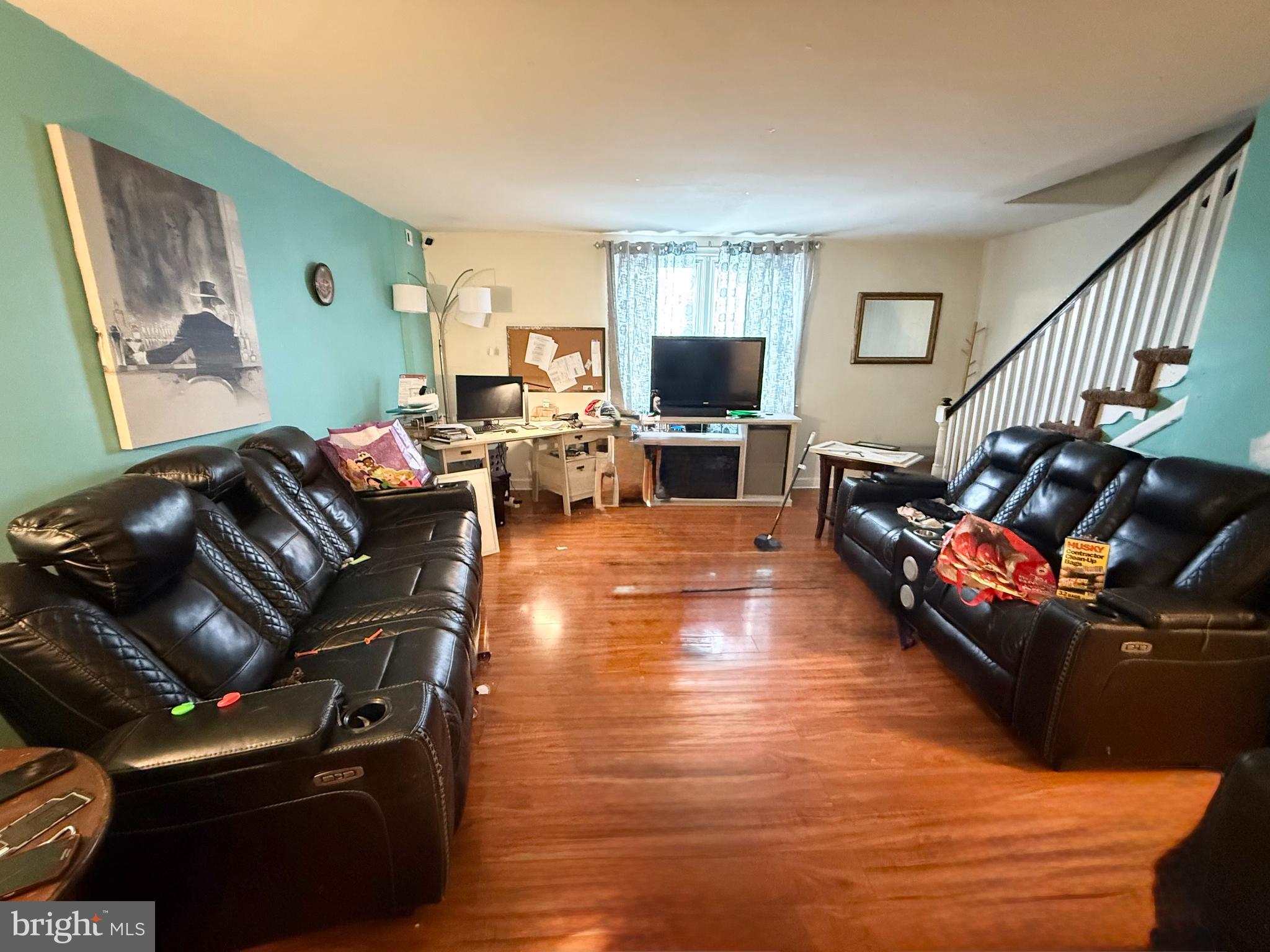 409 North Springfield Road Clifton Heights, PA 19018 - Photo 5 of 10 a living room with furniture or couch and a flat screen tv