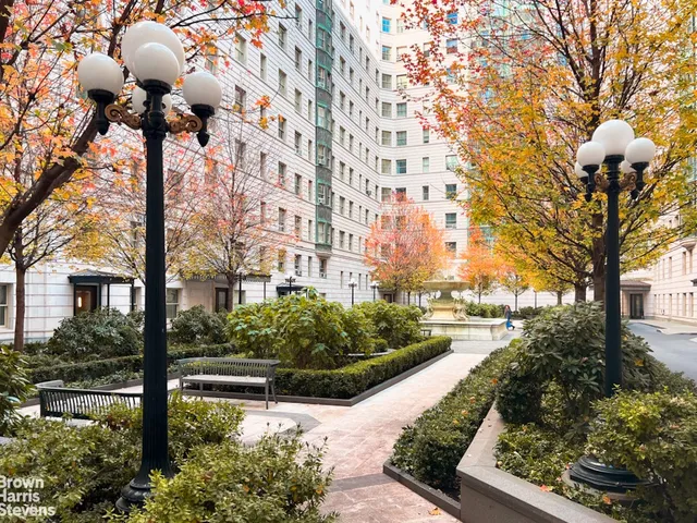 a view of swimming pool with outdoor seating