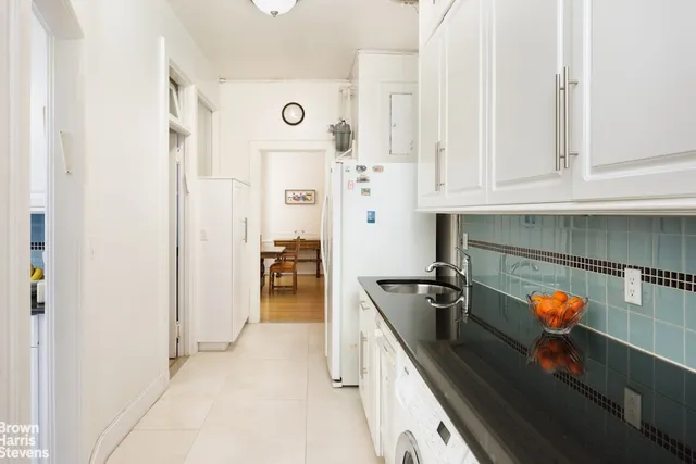a bathroom with a toilet a sink and bathtub