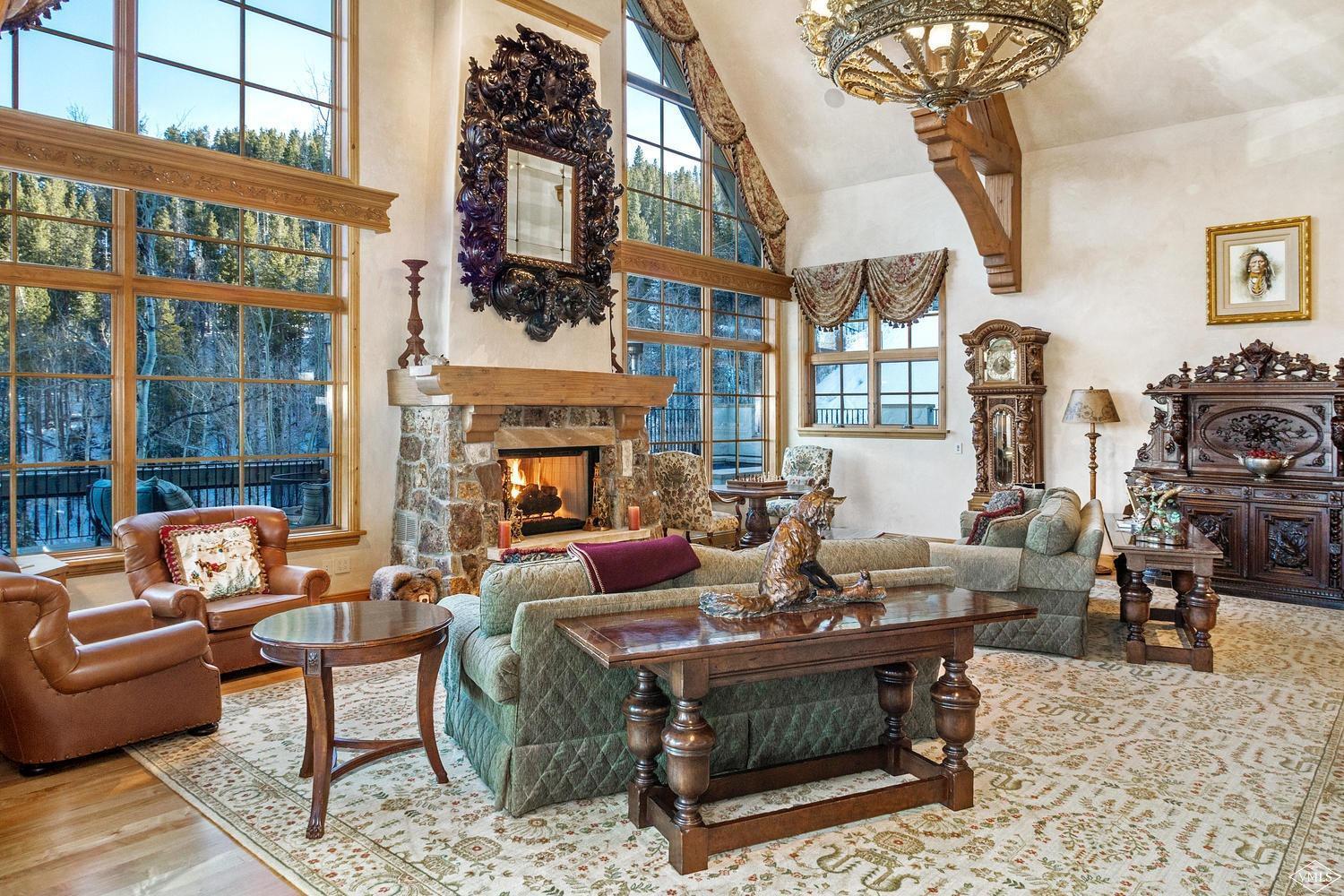 22 Strawberry Park Road Beaver Creek, CO 81620 - Photo 11 of 25 a living room with fireplace furniture and a large window