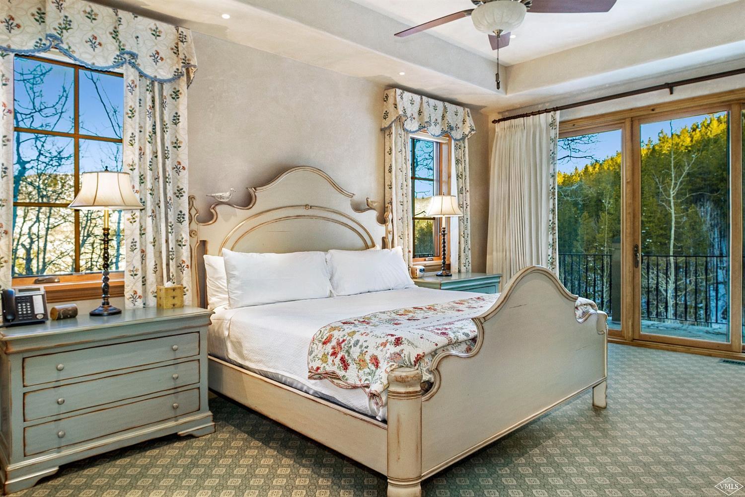 22 Strawberry Park Road Beaver Creek, CO 81620 - Photo 16 of 25 a bed sitting in a bedroom next to a window