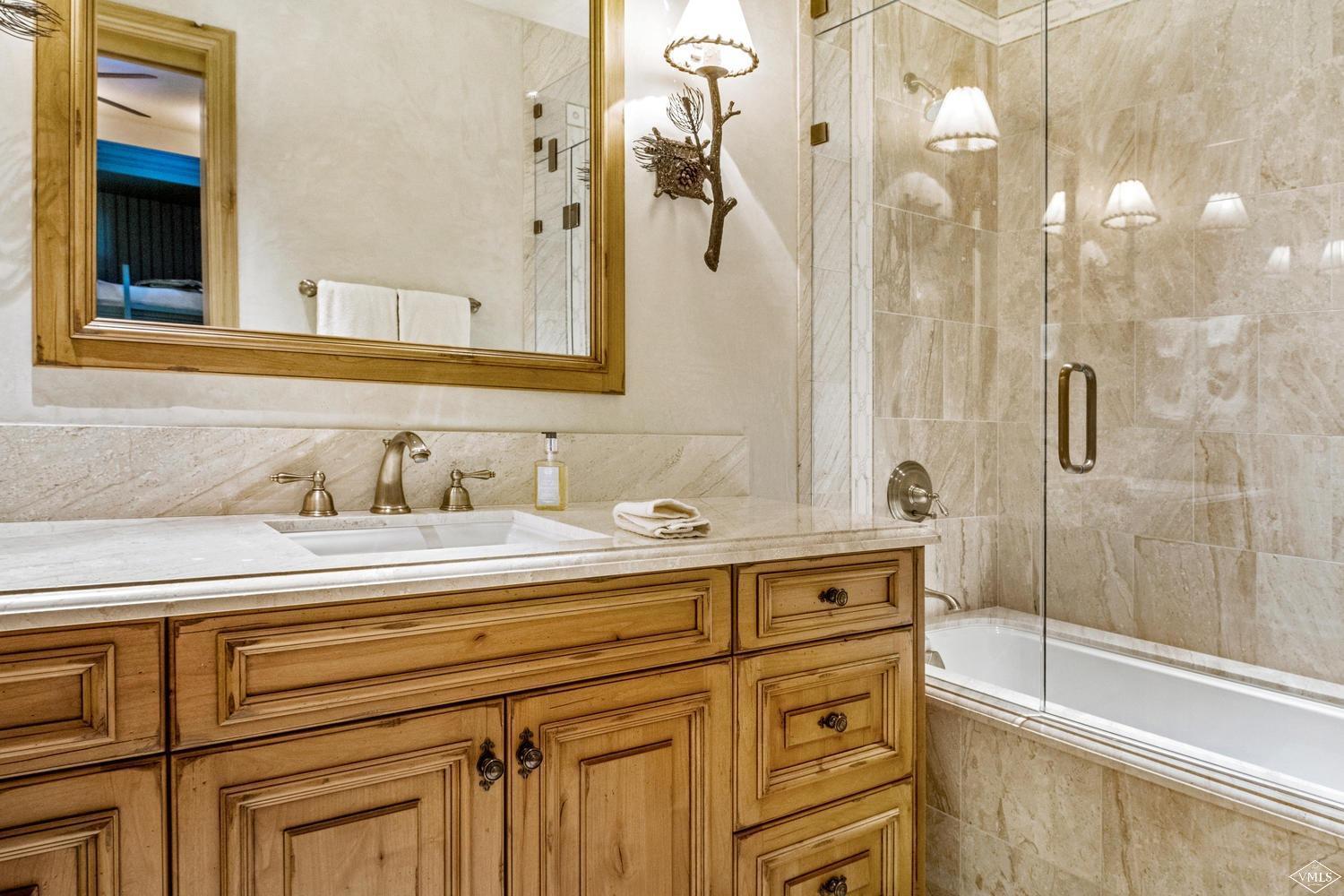 22 Strawberry Park Road Beaver Creek, CO 81620 - Photo 17 of 25 a bathroom with a sink and a mirror