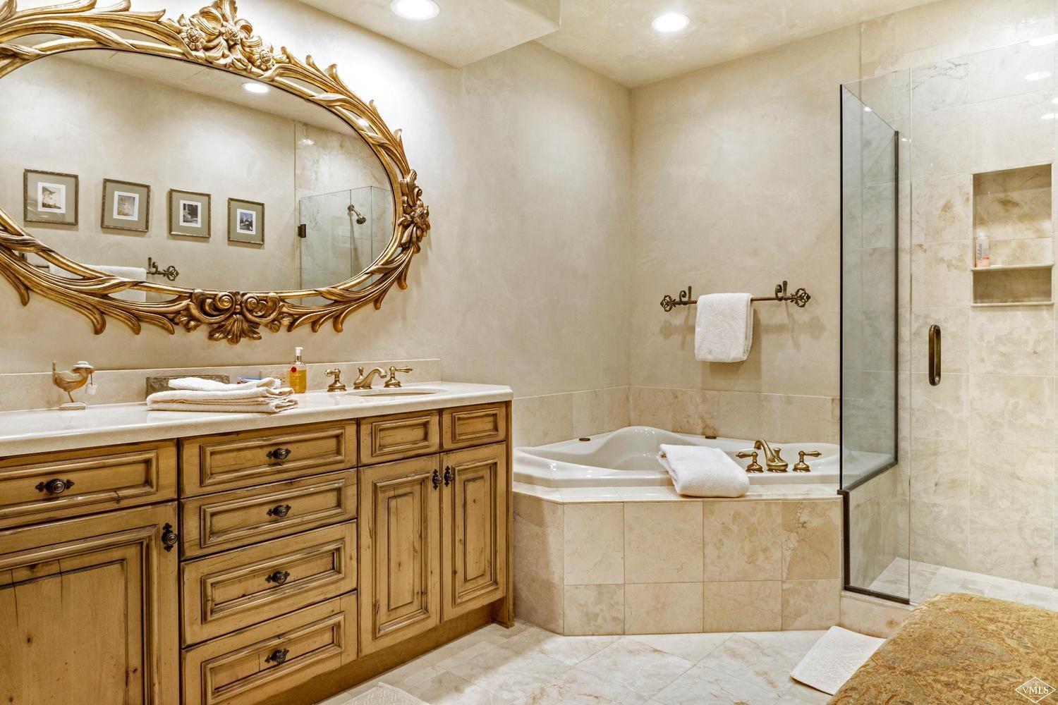 22 Strawberry Park Road Beaver Creek, CO 81620 - Photo 18 of 25 a bathroom with a double vanity sink mirror and shower