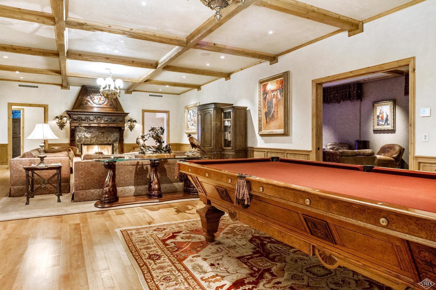 22 Strawberry Park Road Beaver Creek, CO 81620 - Photo 19 of 25 a living room with gym equipment and a table