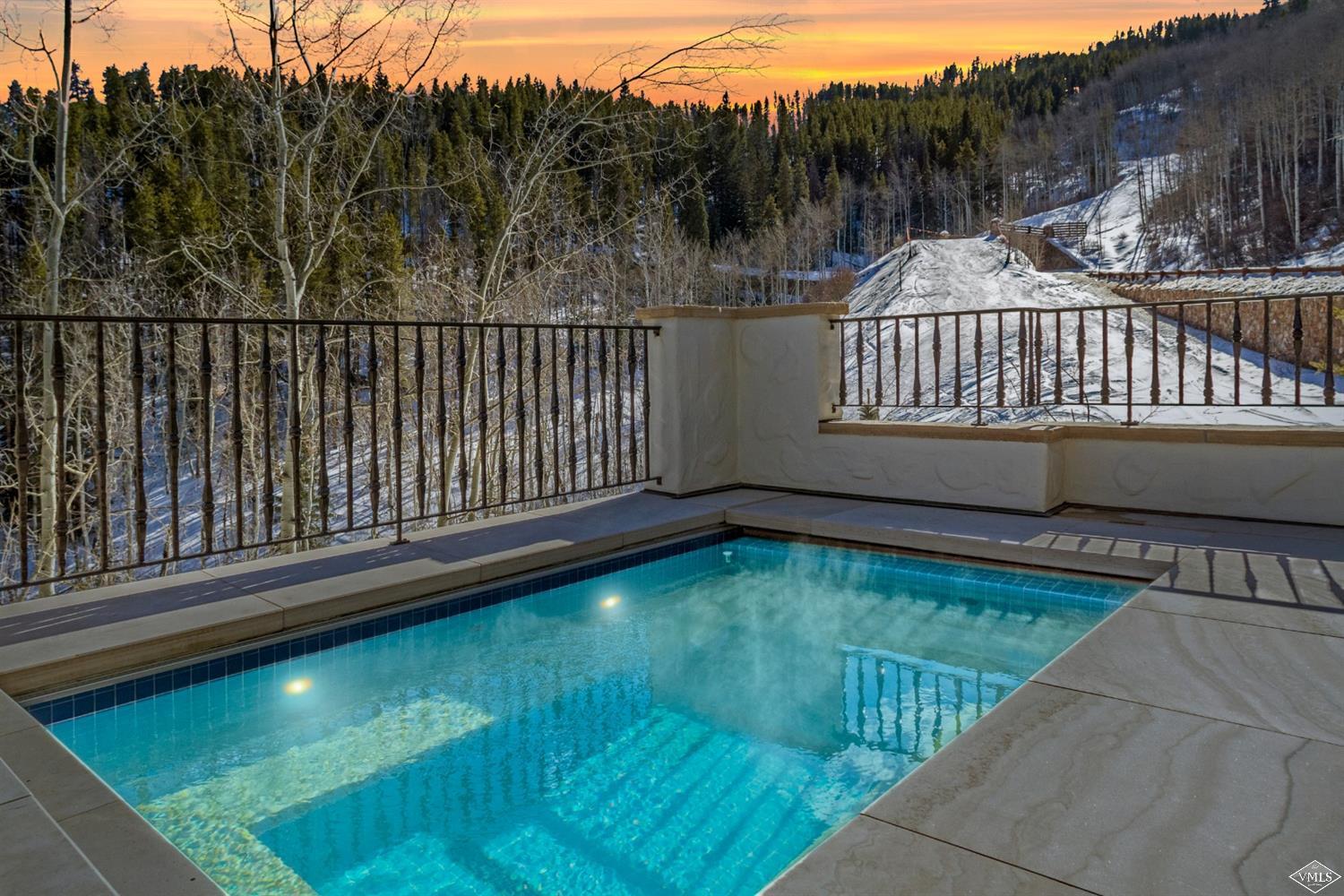 22 Strawberry Park Road Beaver Creek, CO 81620 - Photo 23 of 25 a view of a backyard with a swimming pool