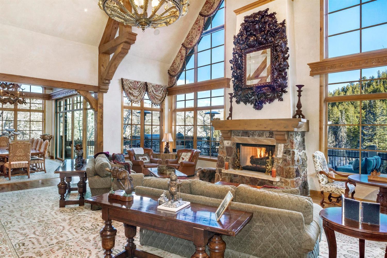 22 Strawberry Park Road Beaver Creek, CO 81620 - Photo 3 of 25 a living room with furniture large window and fireplace