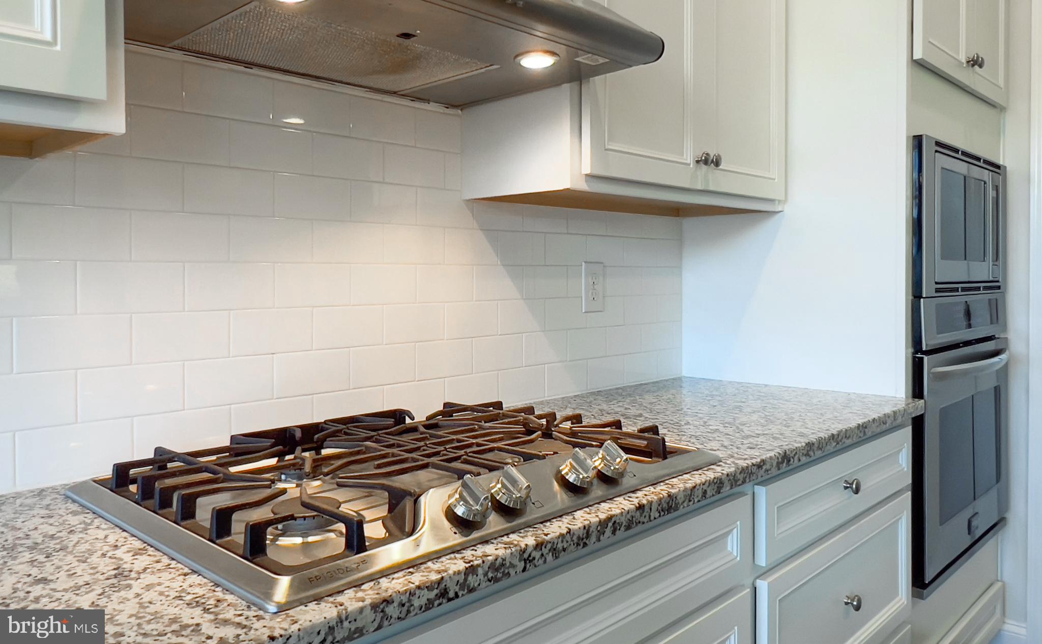 15352 Crape Myrtle Road Milton, DE 19968 - Photo 9 of 41 Gas 5-burner cooktop with quartz countertops